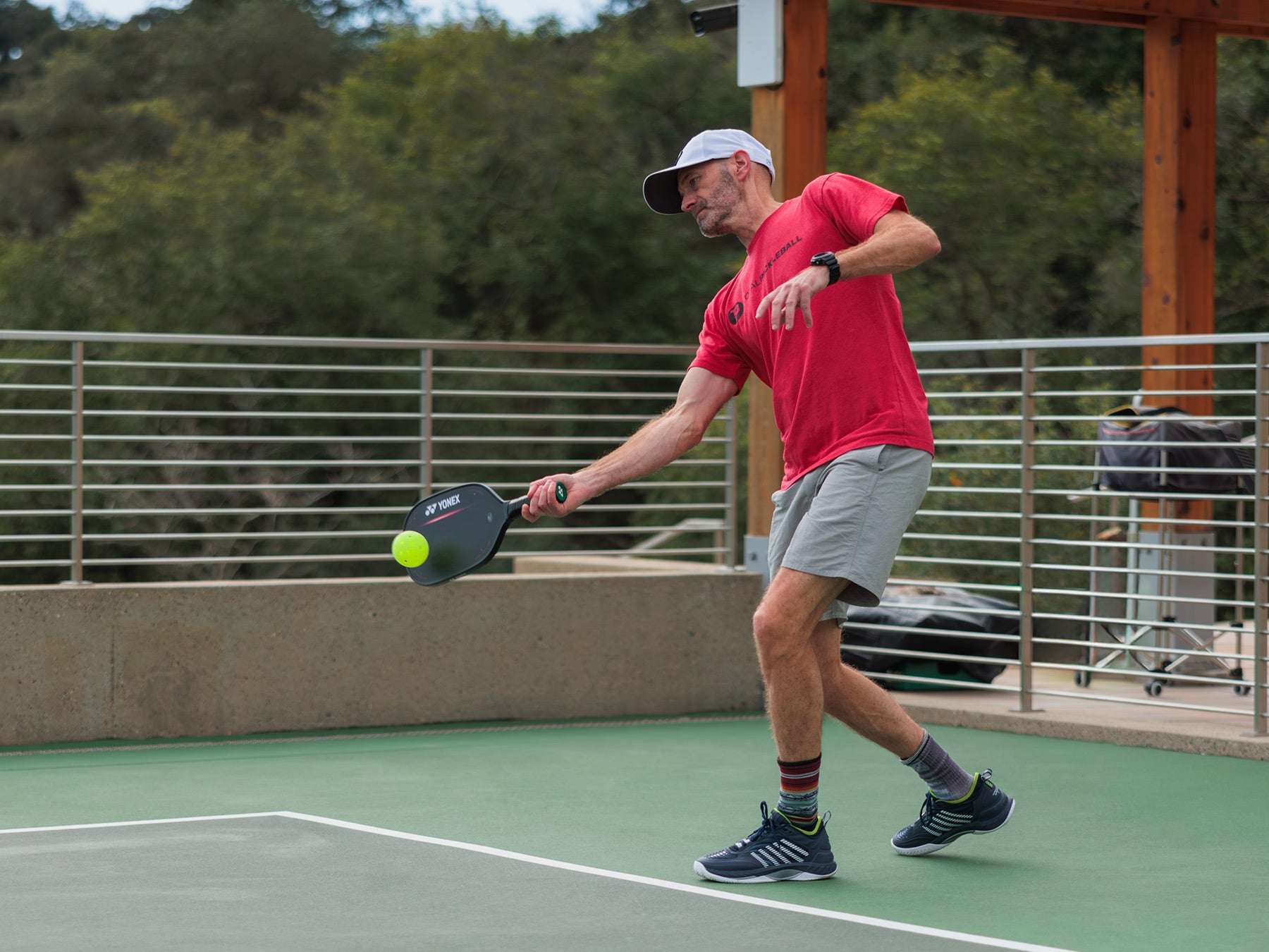 A person about to hit a pickleball, illustrating the most important shot in pickleball.