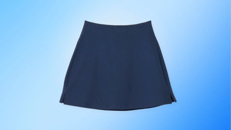 A comfortable and flexible navy blue women's pickleball skirt, an essential piece of apparel for a stylish court outfit.