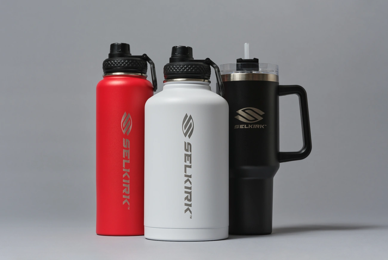 Three large reusable water bottles have different lids and carrying handles.