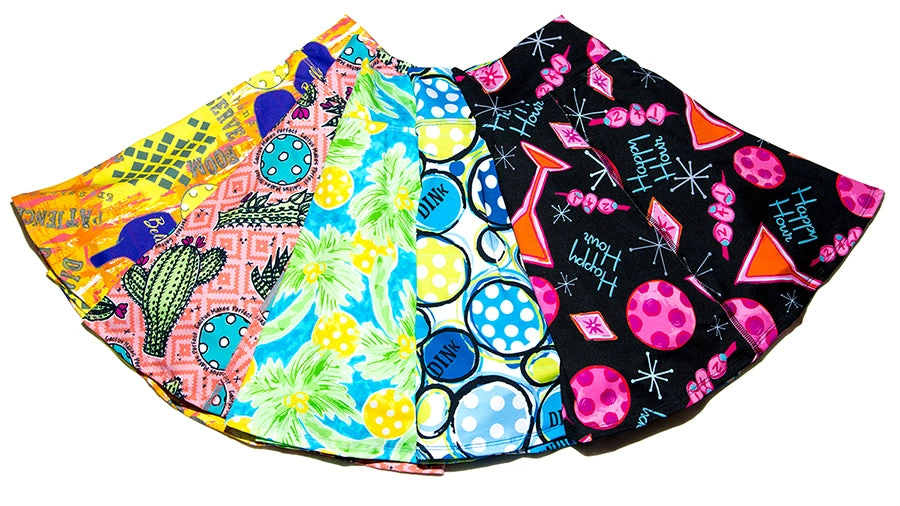A fan of brightly patterned sports skirts shows several colorful prints.