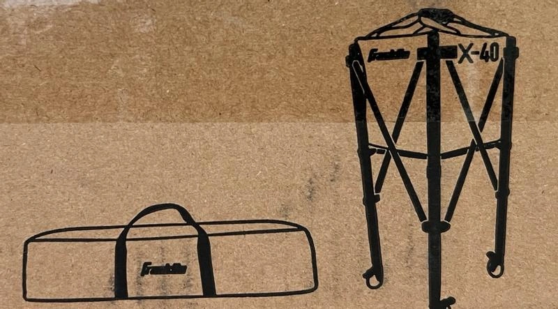 Line drawings on the cardboard packaging for a Franklin X-40 pickleball ball caddy, showing the assembled hopper and its carrying bag.