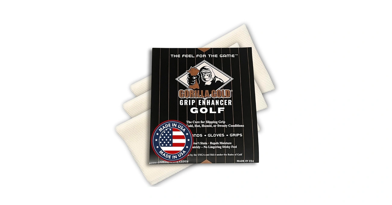 A package of Gorilla Gold Grip Enhancer, a tackifying cloth for sports grips, shown stacked on three white cloths against a white background.